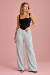 Wide-leg trousers with V-cut elasticated waist