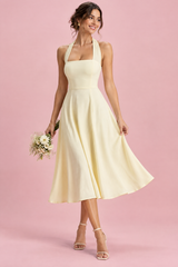 Light yellow skater-style midi dress with a square neckline
