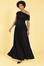 Robe longue de grossesse noire à encolure asymétrique et taille basse | Vue en mouvement | Lounelle Paris