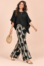 Ensemble pantalon noir à pois | Vue en mouvement | Lounelle Paris
